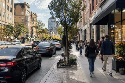 A city street with shops and people