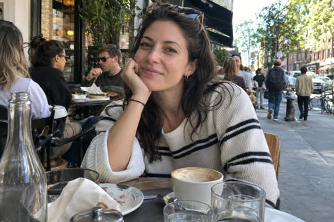 A woman in a busy café